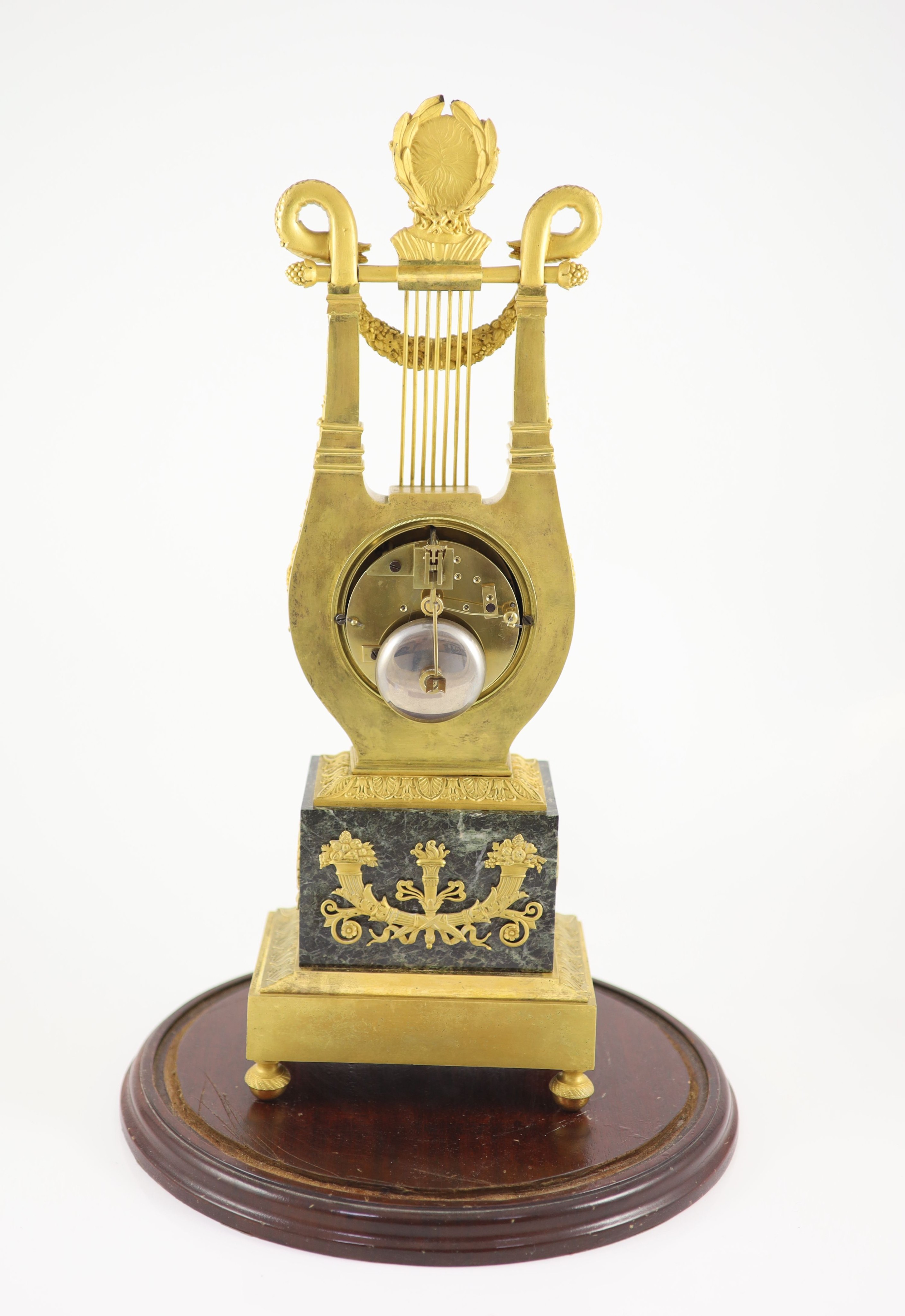 A 19th-century French ormolu and marble lyre shaped mantel clock H 52cm. W 18cm. D 12cm.